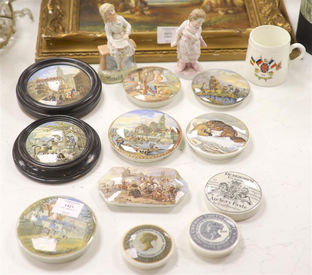 A collection of eleven Pratt pot lids, two Continental porcelain figures and a coronation mug